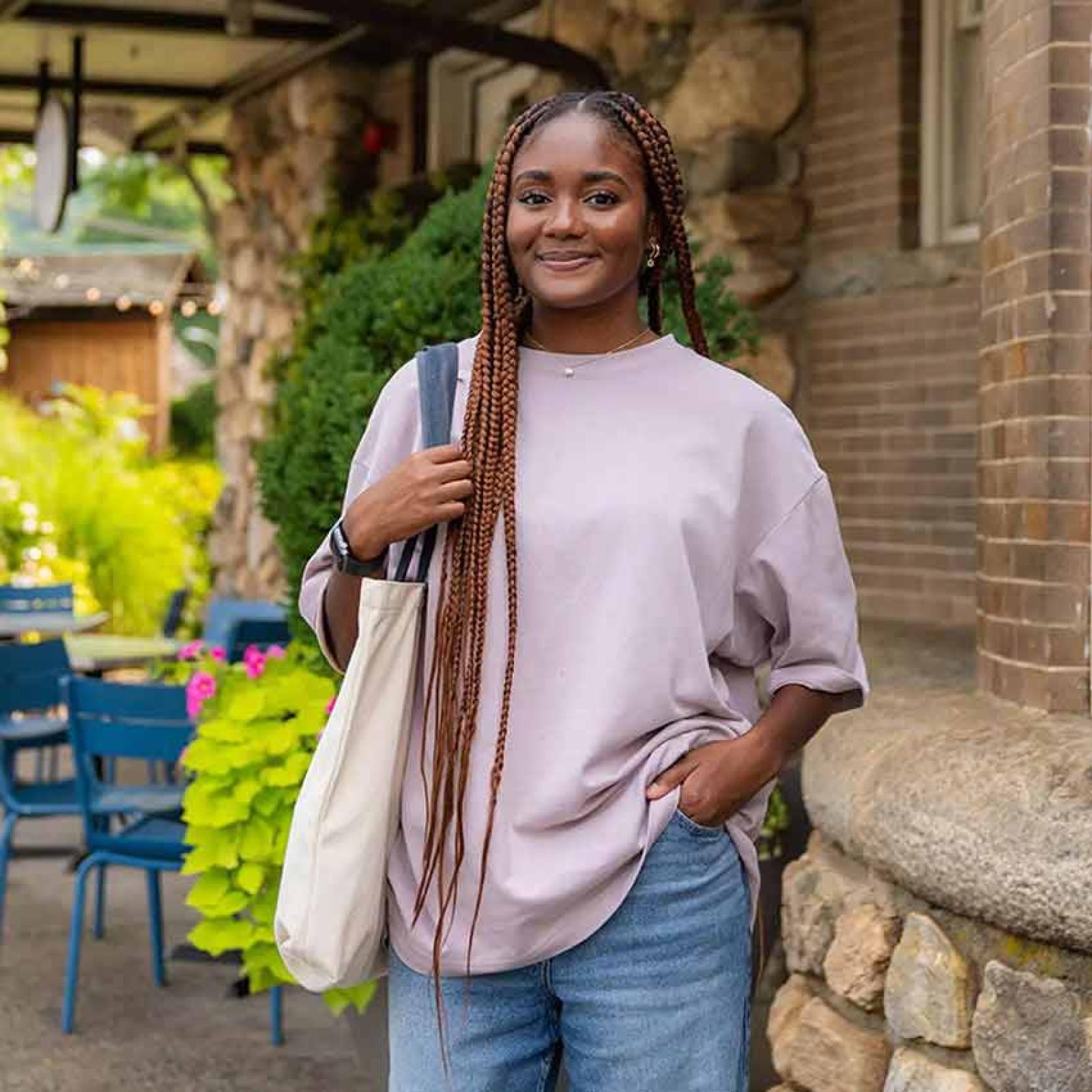 Pace University student smiling at the camera.