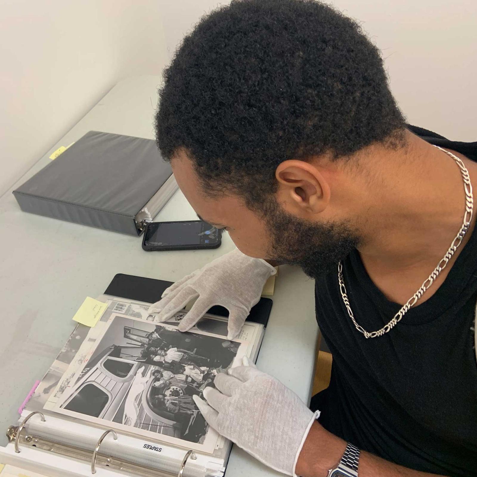 student looking at photo