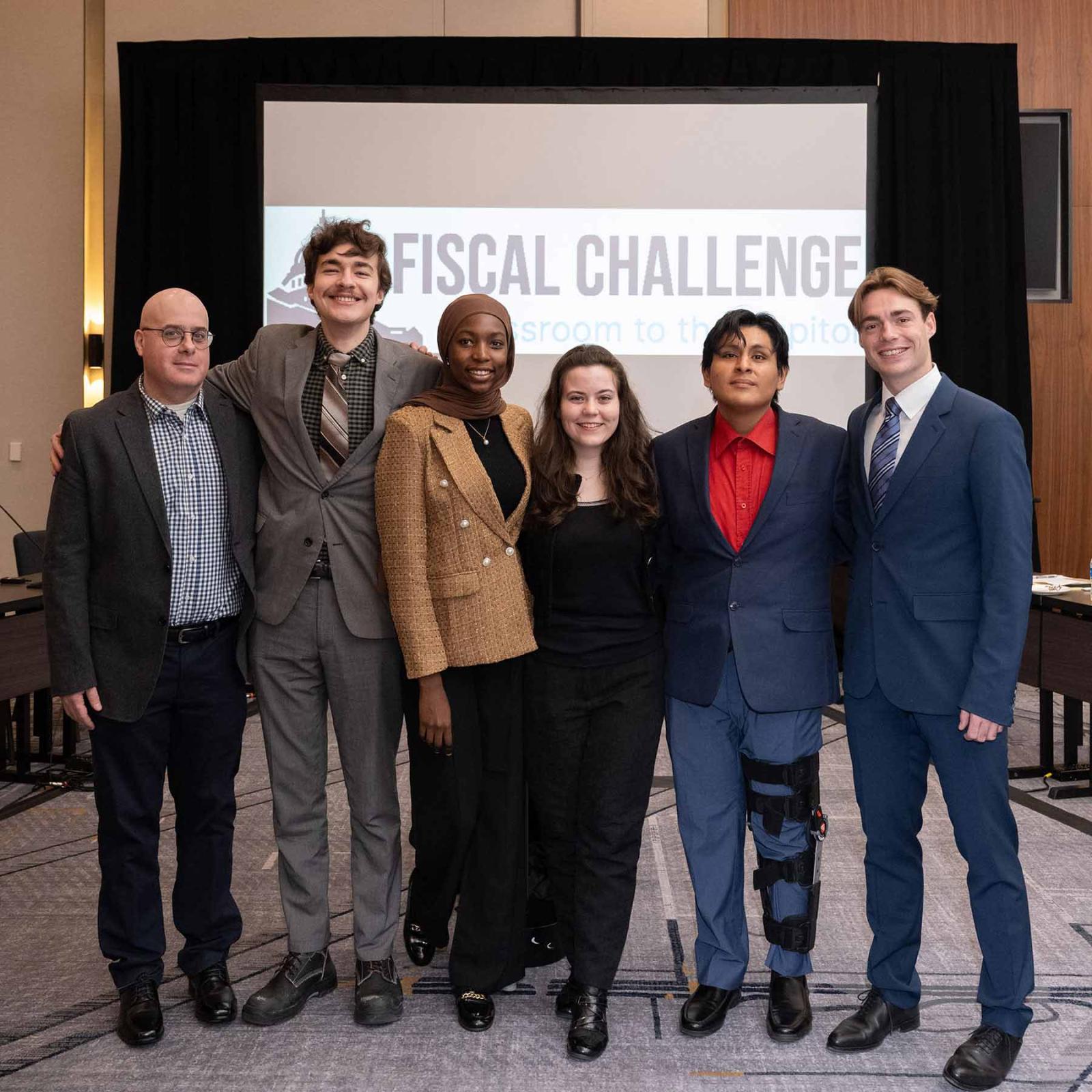 Pace University Economics Professor Sam Baruch with students from the Fiscal Challenge Team including William Winn, Fatima Abba, Kristina Krichmaryov, Angel Uzhca, and Victor Soulan