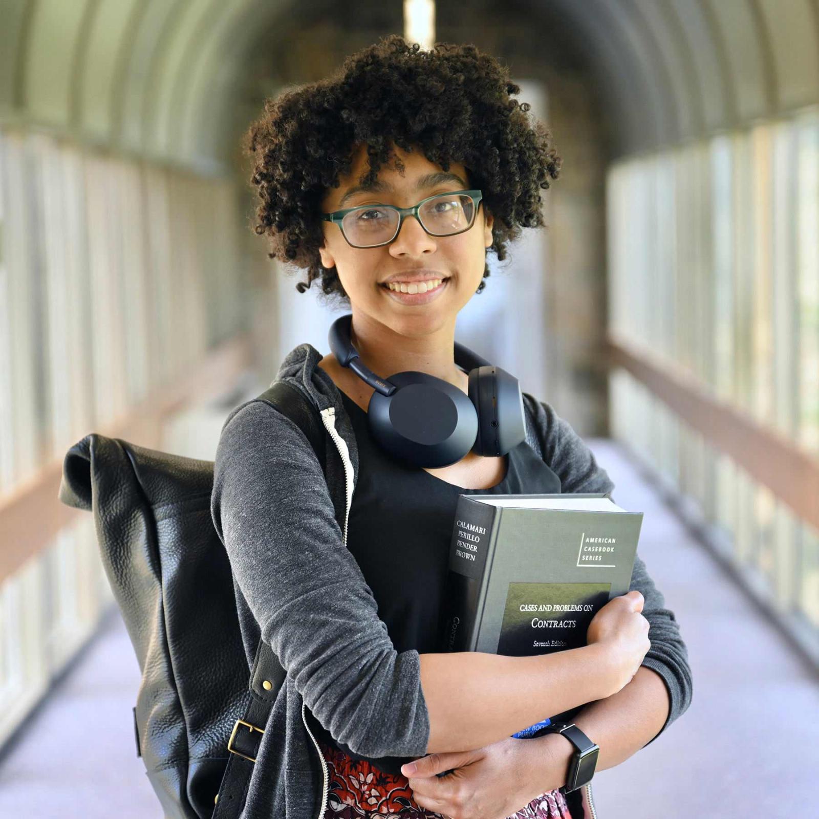 Elisabeth Haub School of Law student posing for a photo in a hallway on campus.