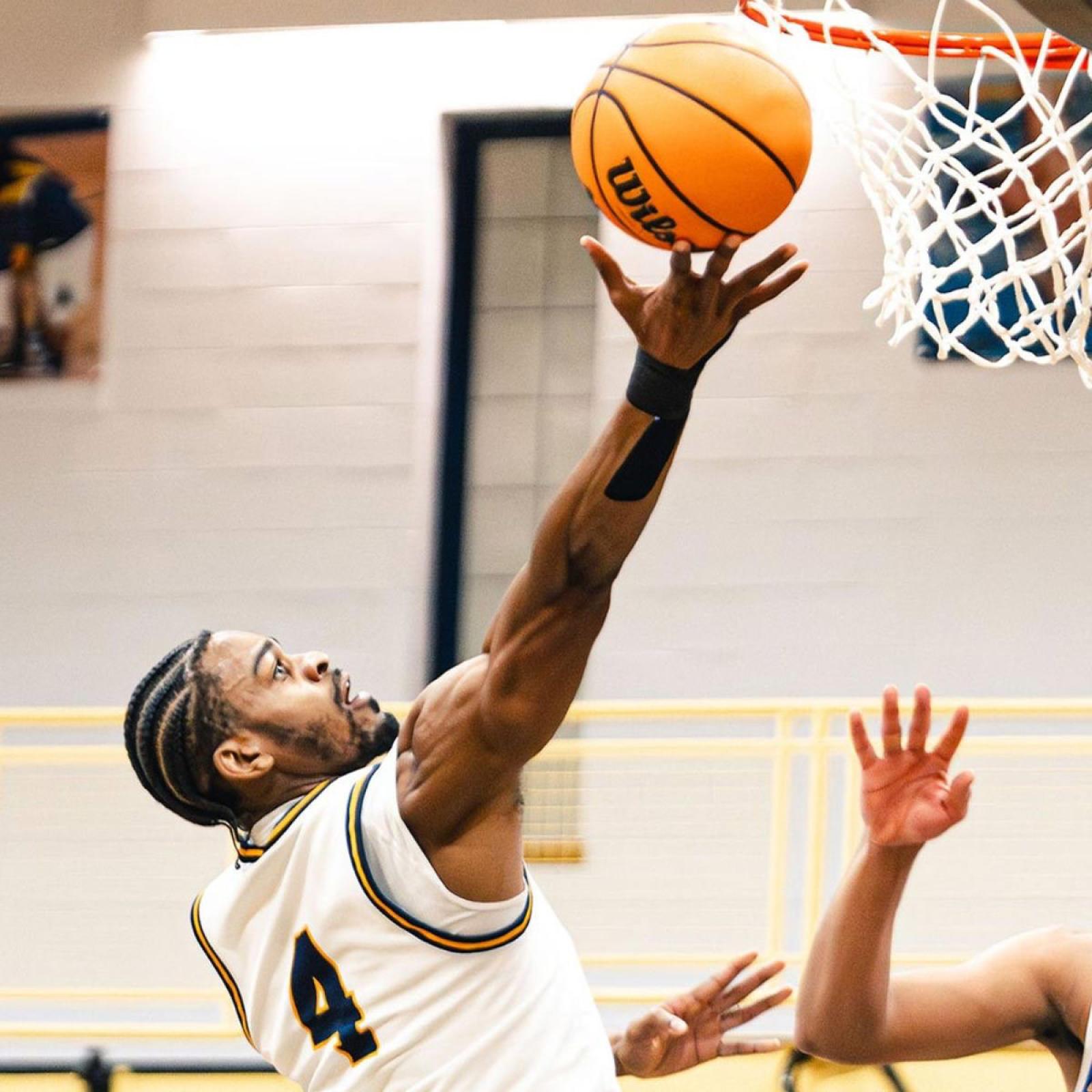 Pace Men's Basketball Player Jabari Nurse going up for a layup.