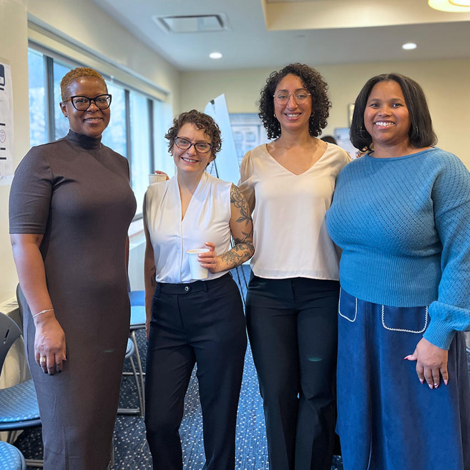 Group of Pace University PHD in Nursing students smiling at the camera.