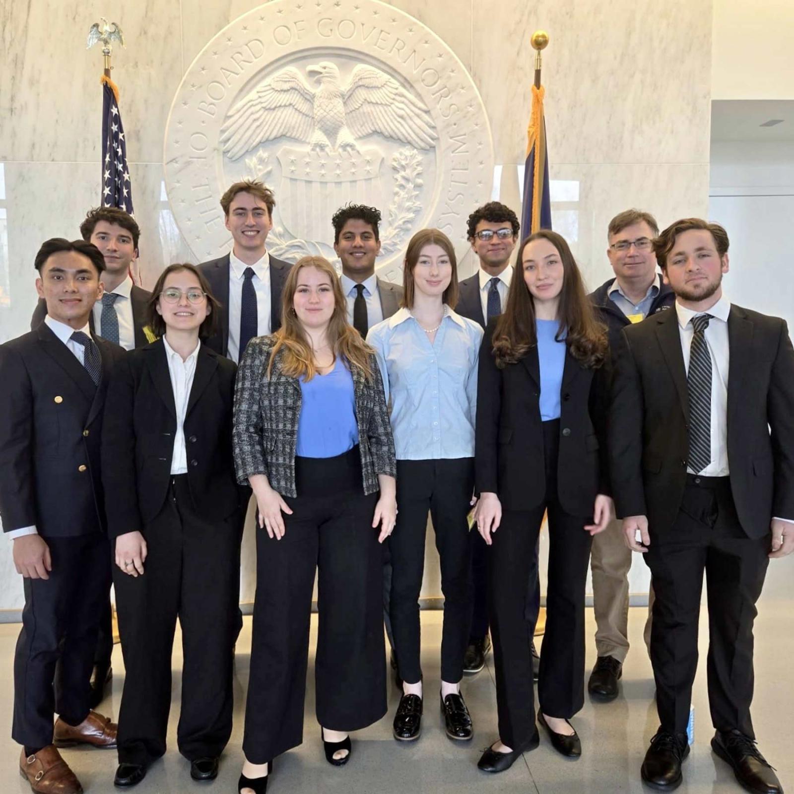 The Pace University Federal Reserve Challenge team standing together after winning the New York Regional College Federal Reserve Challenge competition