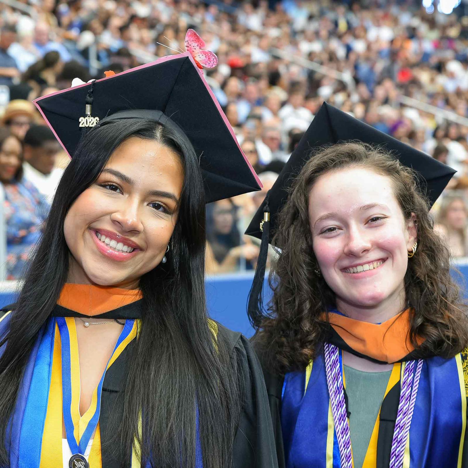 Two graduates at Pace university's 2026 commencement ceremony