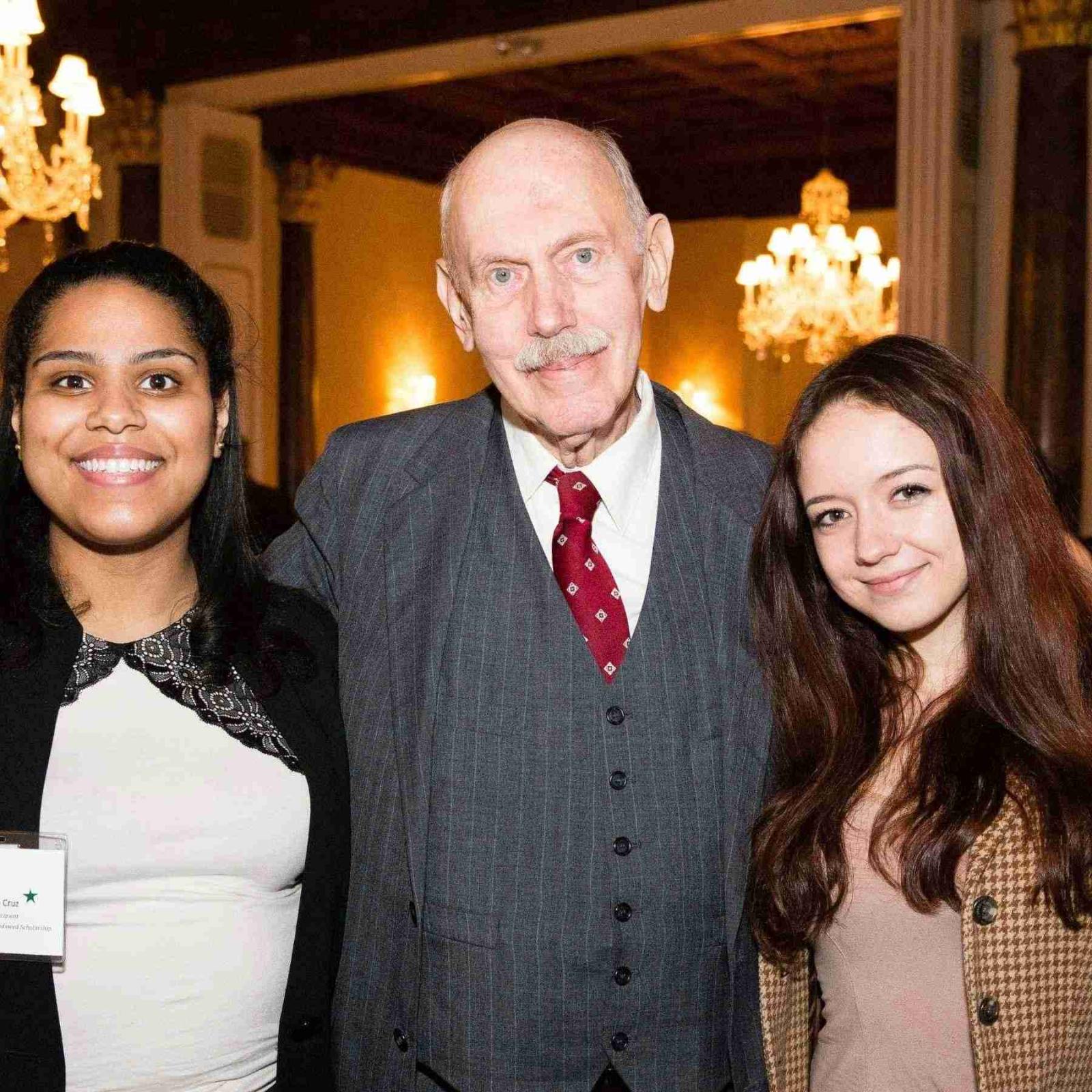 Henry Petermann '60 posing with scholarship recipients