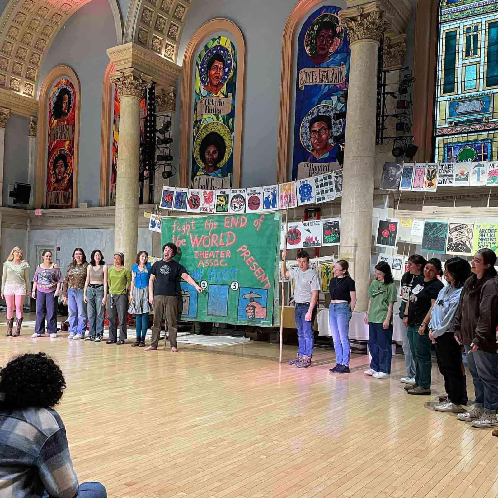 Pace University's Peace and Justice Studies and English students holding up artwork and working with the Bread and Puppet Theater to express social justice through art.