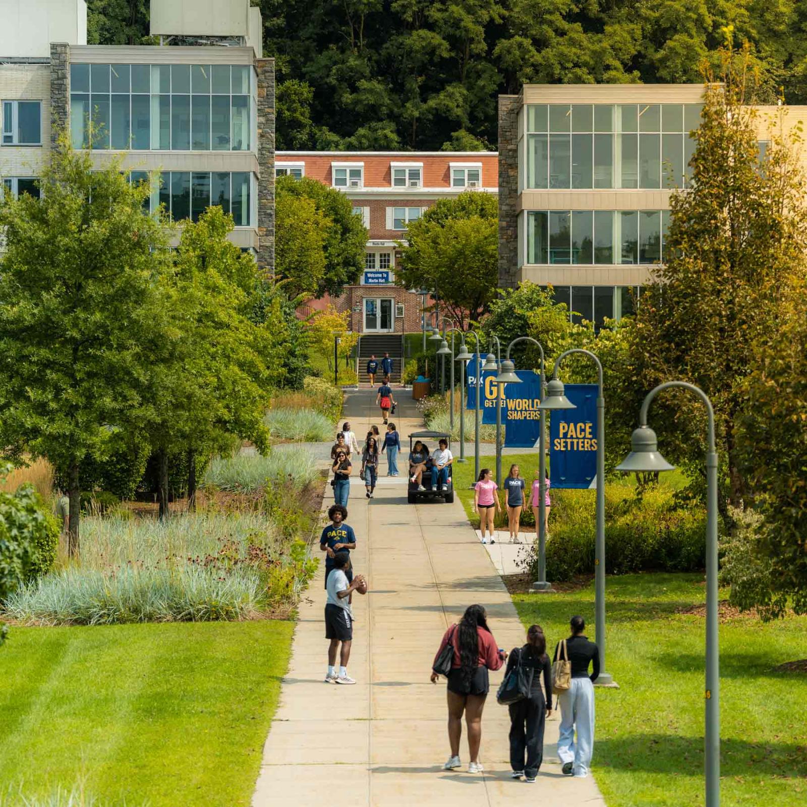 Aerial shot of Pace University's Westchester campus showing buildings and students walking around campus.