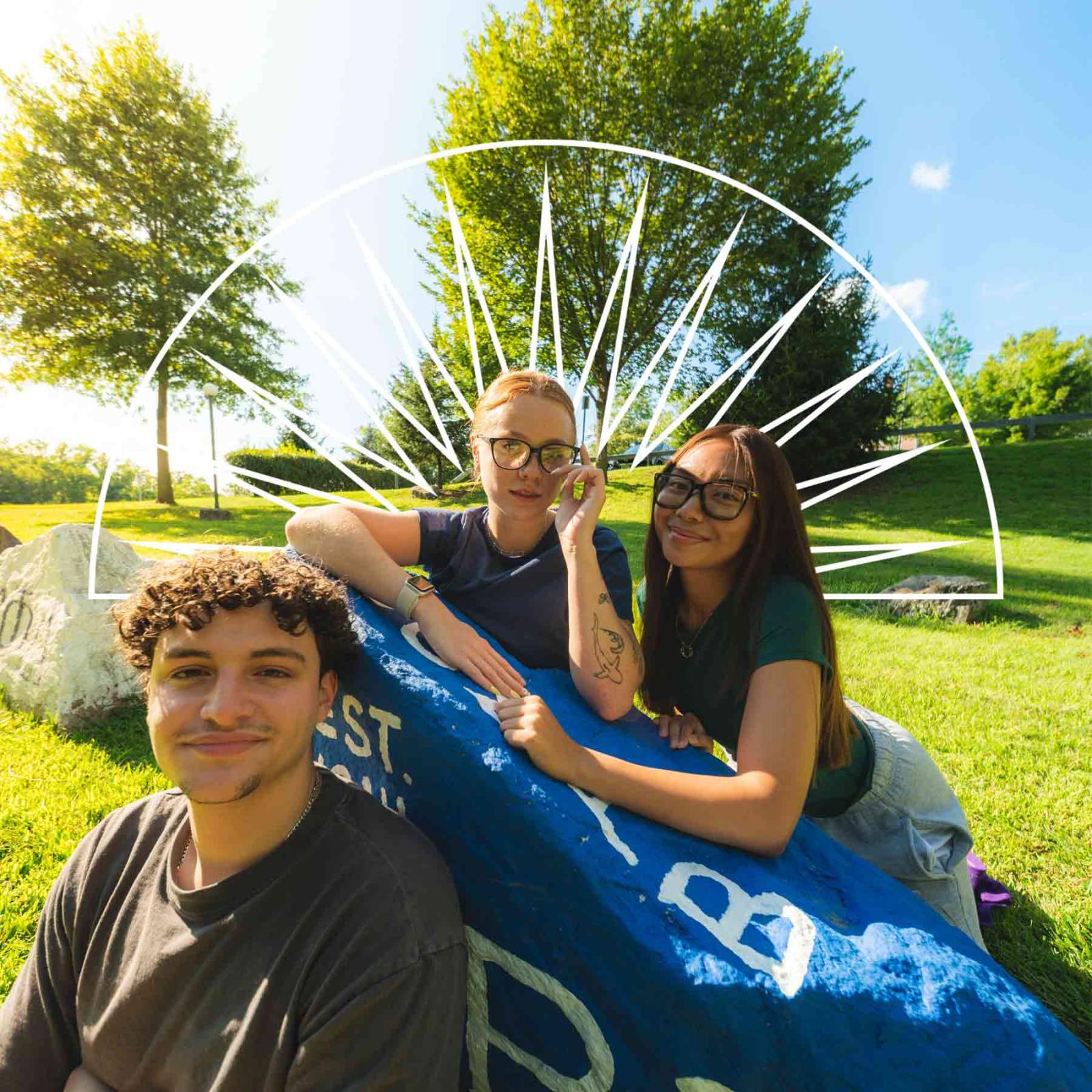 Group of Pace University students smiling at the camera on the Westchester campus.
